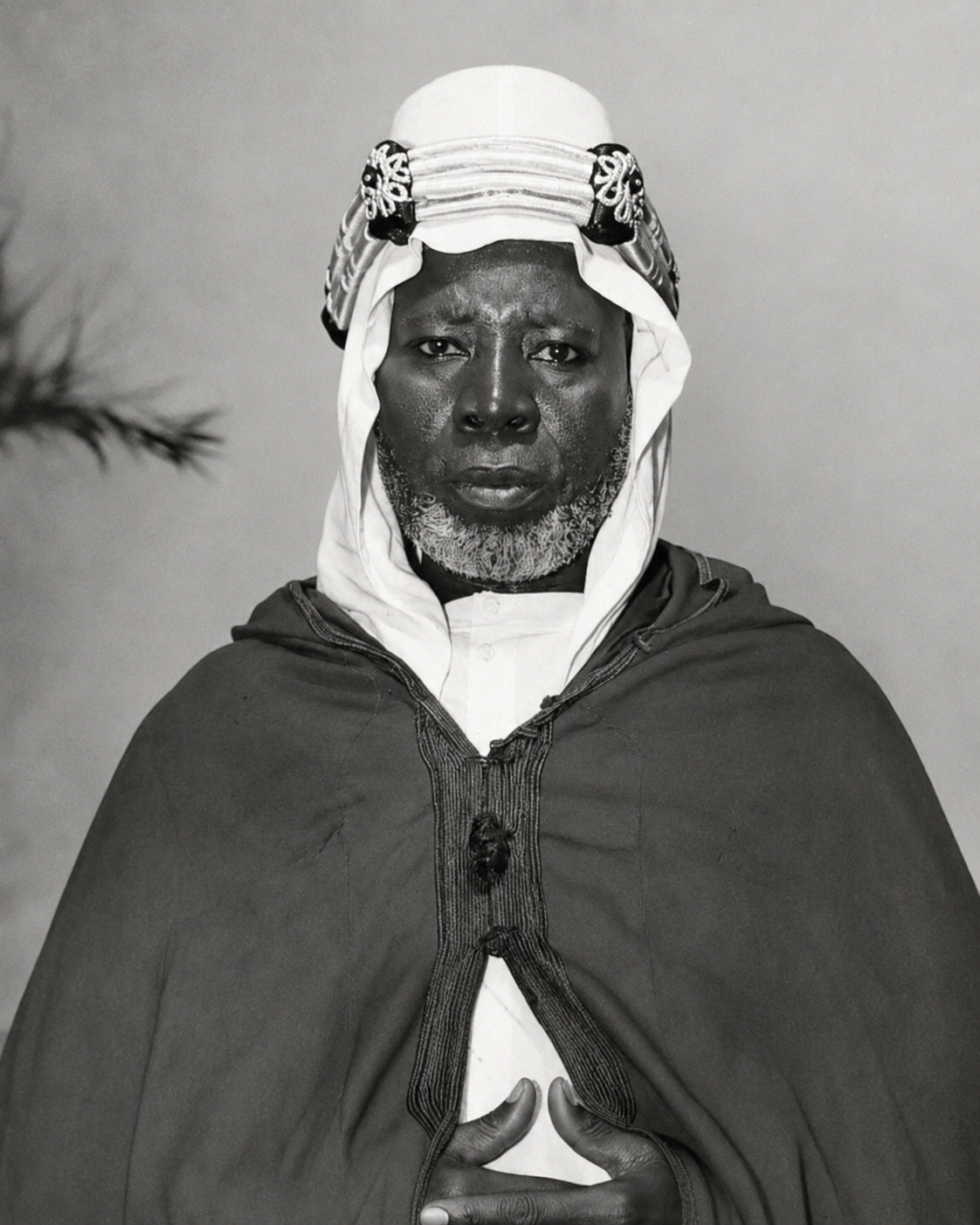 Kharim Kouanda in traditional dress, family archive portrait.
